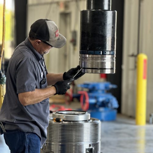 Downing technician repairing a valve in the shop