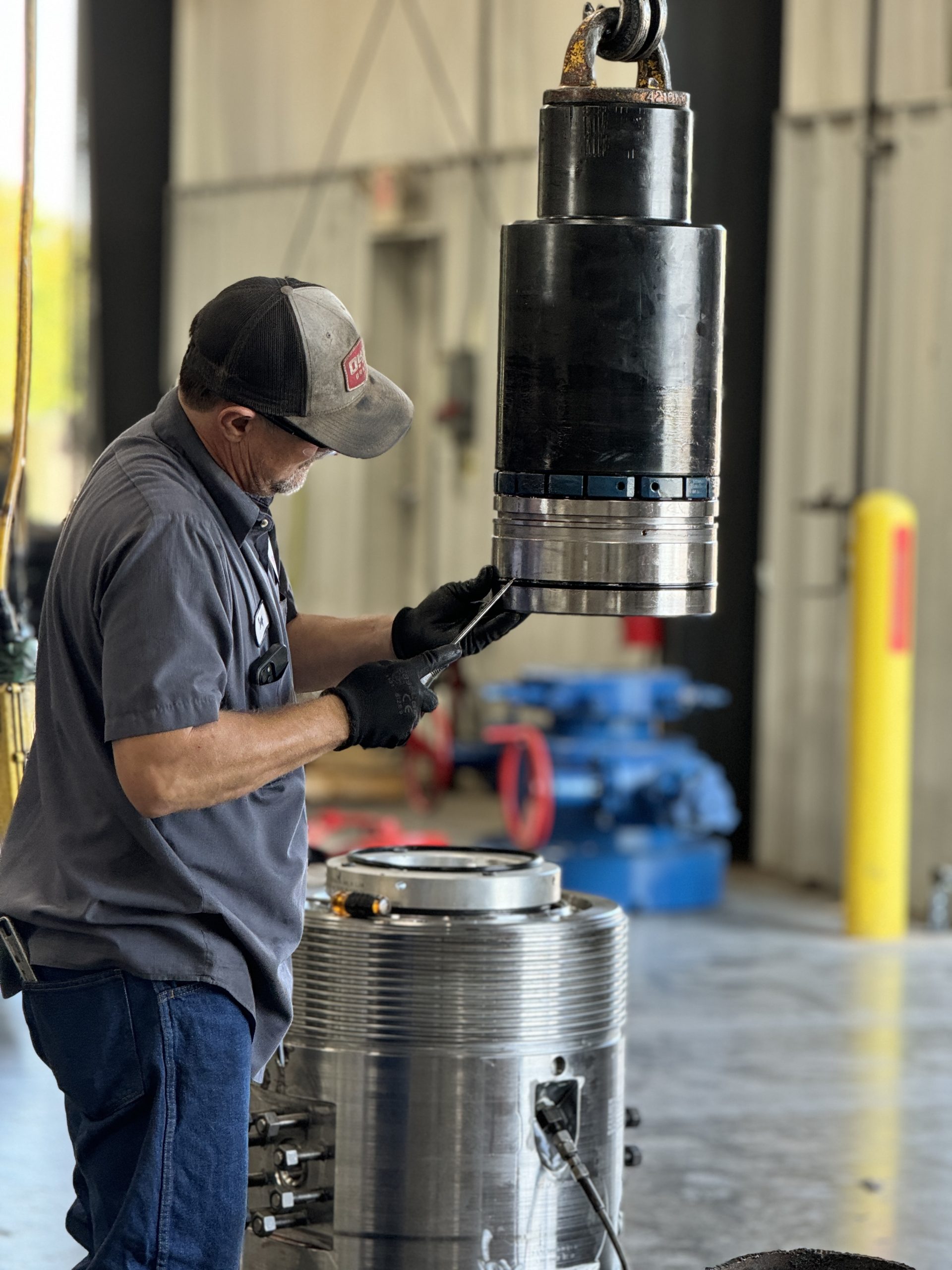 Downing technician repairing a valve in the shop